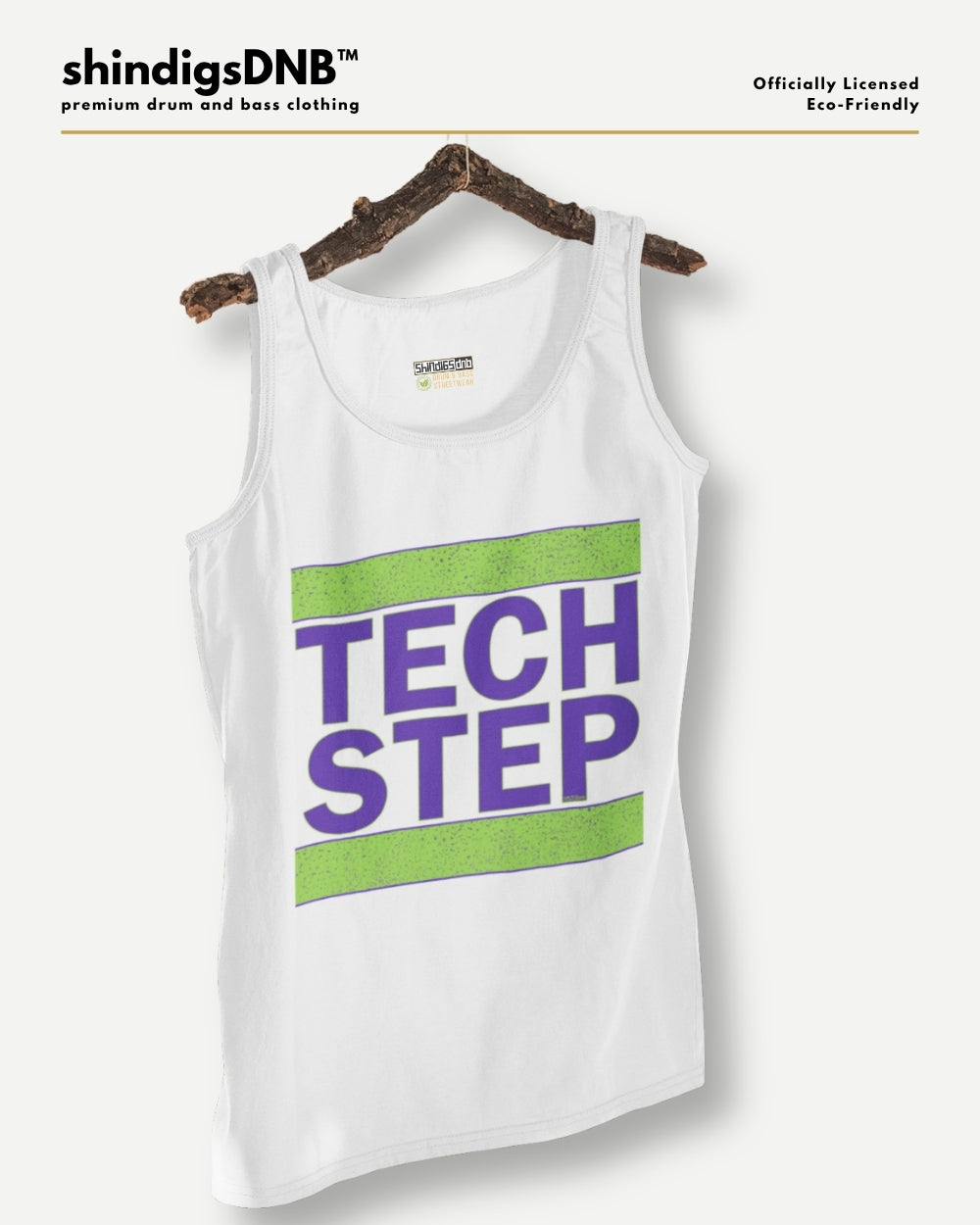 A white tank top hanging on a rustic wooden hanger against a light gray background. The tank top features a graphic print with the words 'TECH STEP' in purple text between two horizontal lime green stripes.