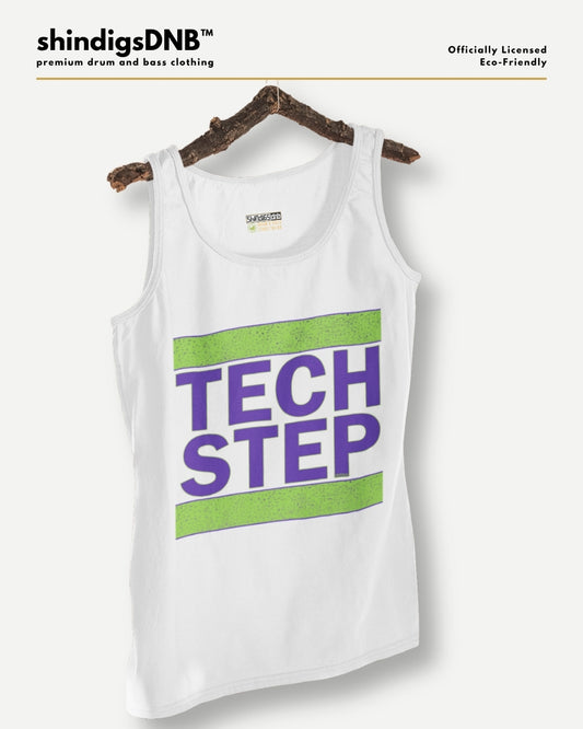 A white tank top hanging on a rustic wooden hanger against a light gray background. The tank top features a graphic print with the words 'TECH STEP' in purple text between two horizontal lime green stripes.