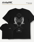 Black short-sleeve t-shirt with a large white graphic of a winged figure inside geometric line art, shown on a light gray background with a smaller inset of the front view. Text at top reads 'shindigsDNB' and 'Officially Licensed Eco-friendly'.