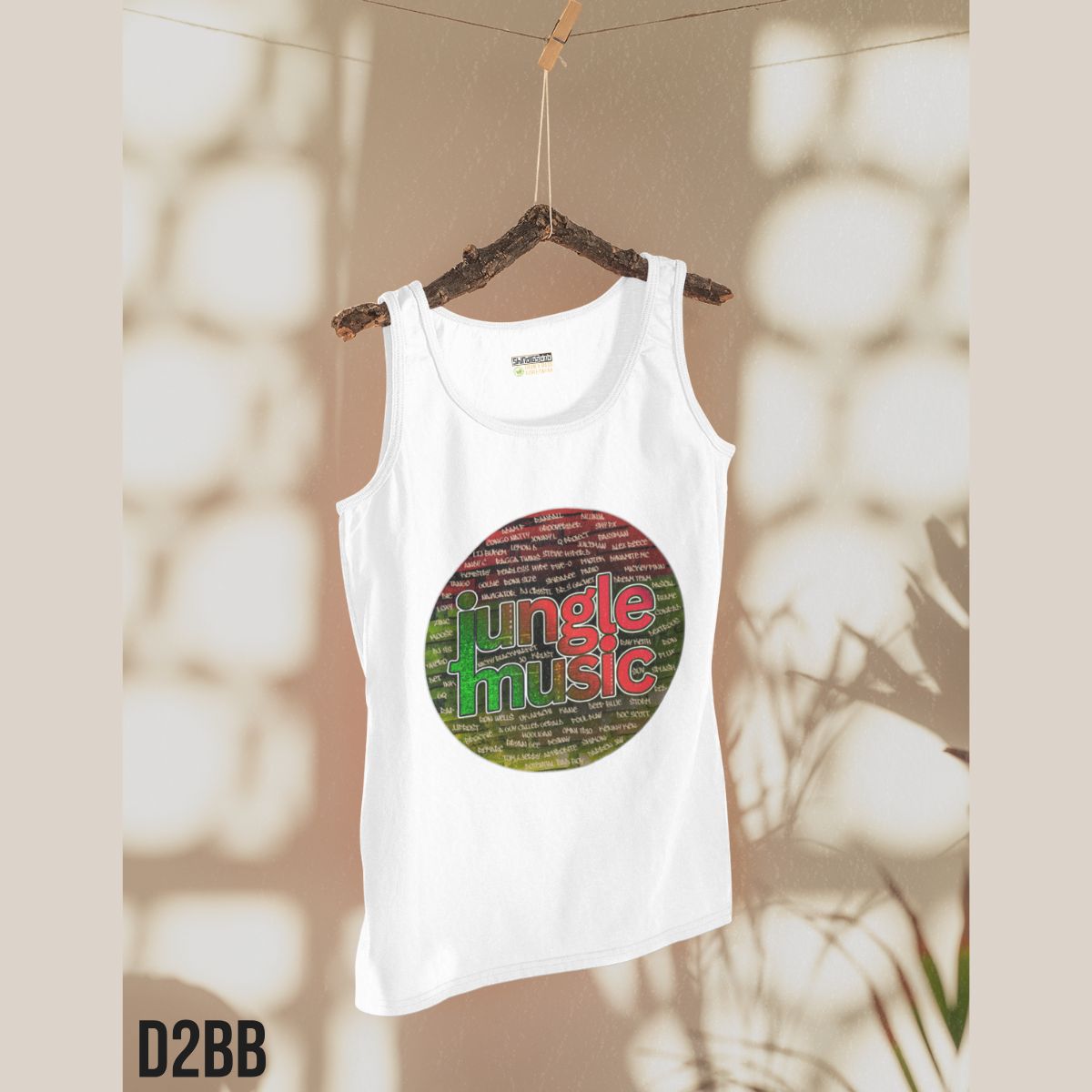 White tank top with 'jungle music' design on a hanger against a neutral background