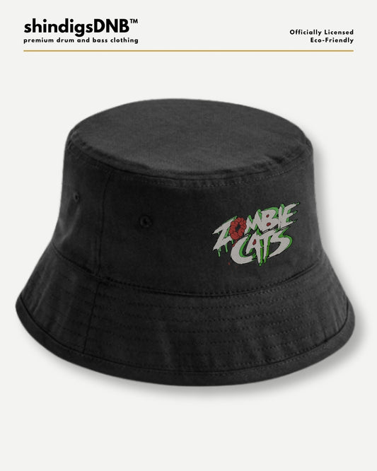 A black bucket hat with a colorful embroidered 'Zombie Cats' logo on the front, displayed against a light gray background with branding text at the top.