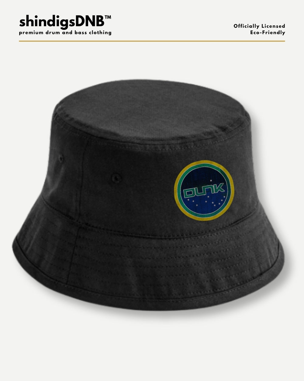 A black bucket hat with a circular embroidered patch featuring the word 'CUNK' in green on a blue background with a yellow border, shown on a light gray background with branding text at the top.