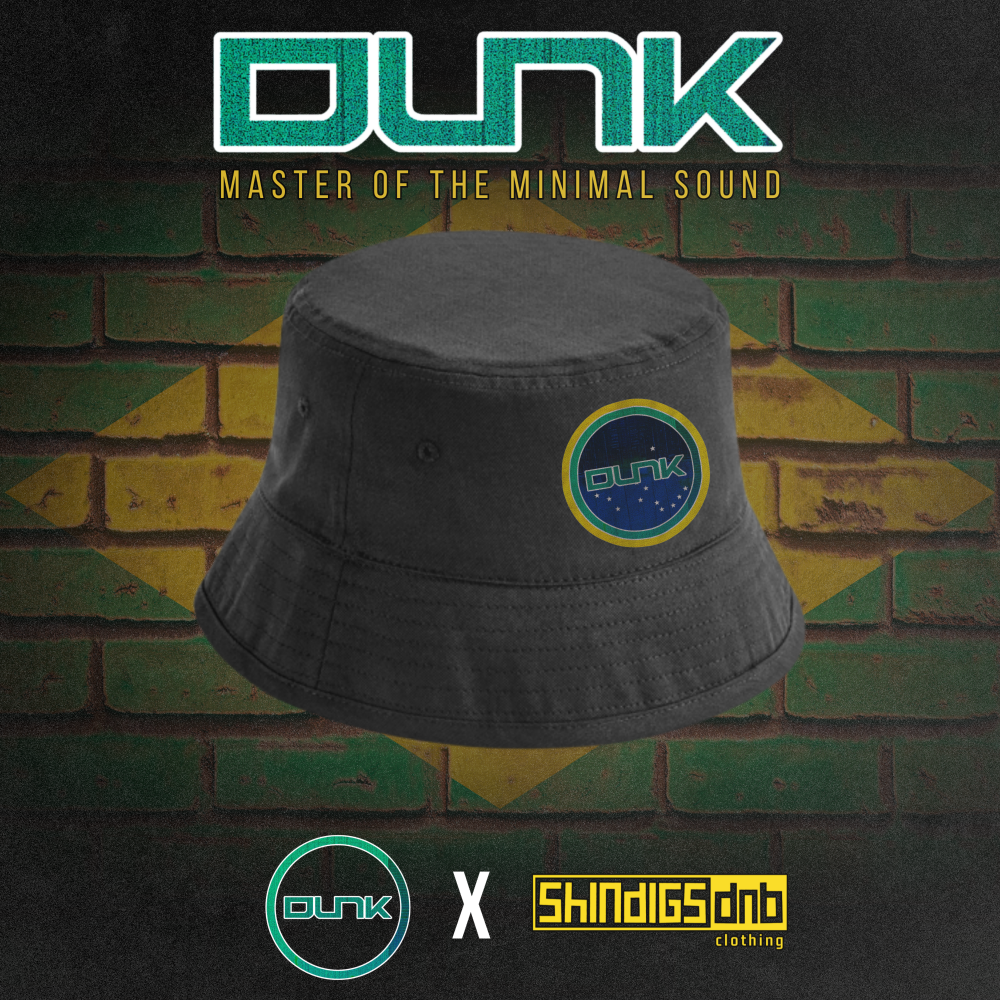 Black bucket hat with 'Dunk' logo on a brick wall background