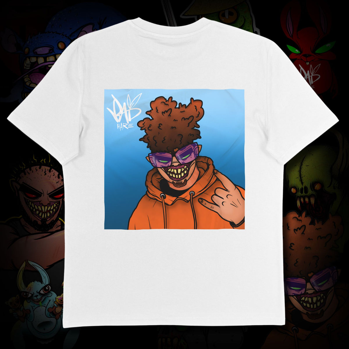 White t-shirt with a graphic of a person in an orange hoodie and sunglasses on a dark background.