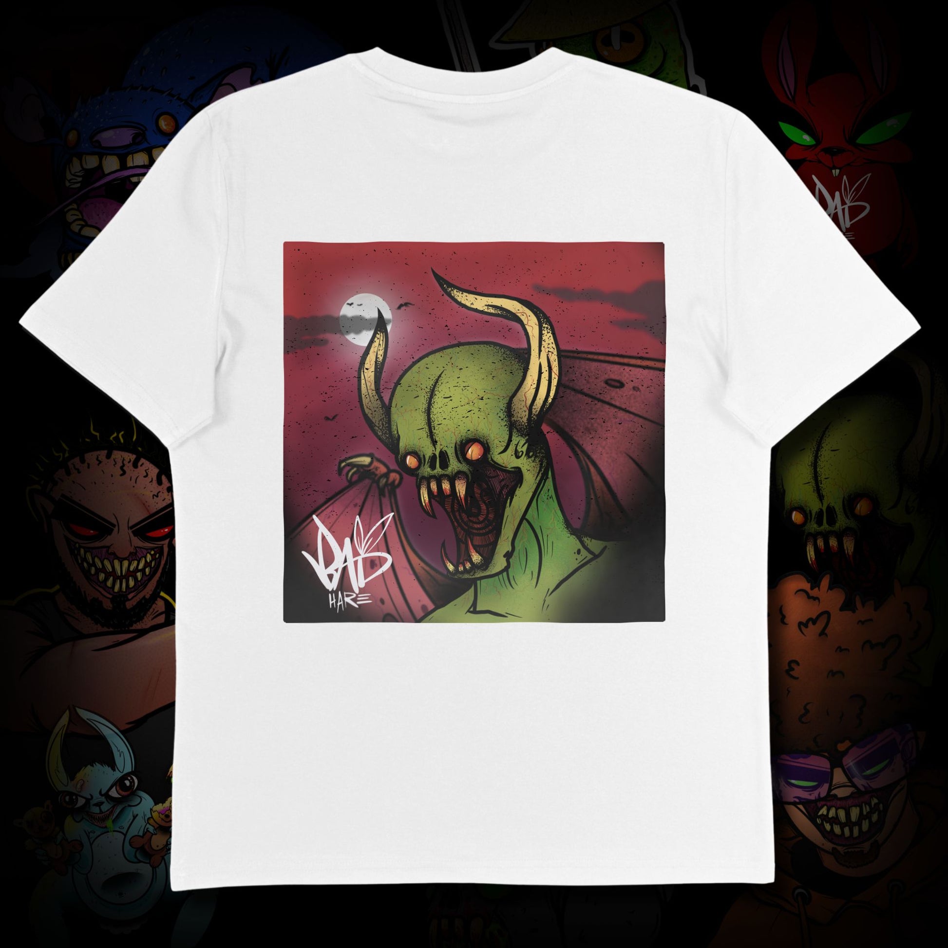 White t-shirt with a graphic design of a green creature on a dark background