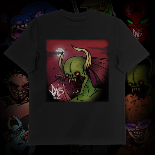 T-shirt with a graphic design of a green creature with horns on a dark background