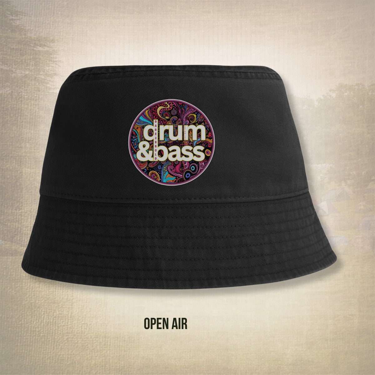 Black bucket hat with 'drum & bass' logo on a textured beige background