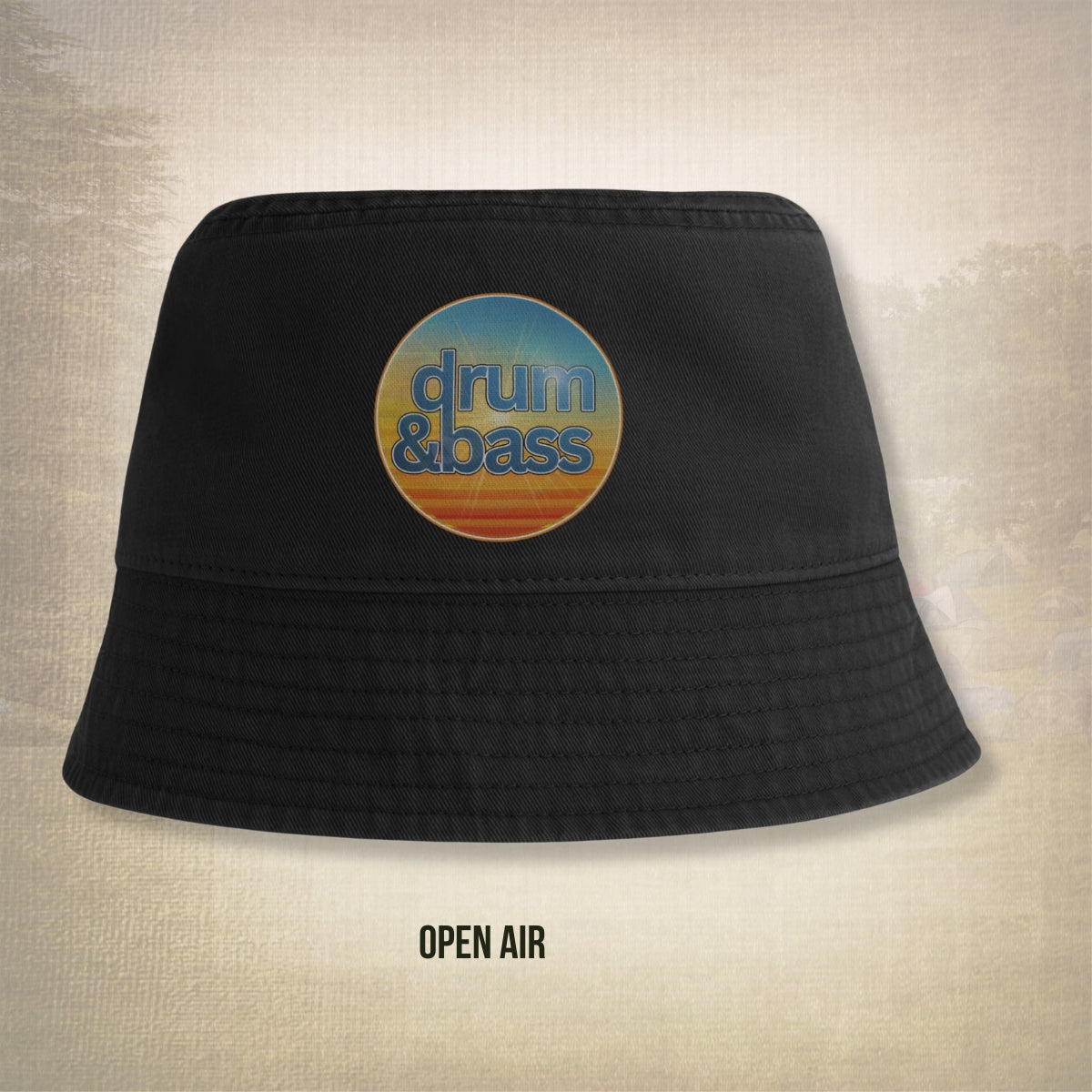 Black bucket hat with 'drum & bass' logo on a textured beige background