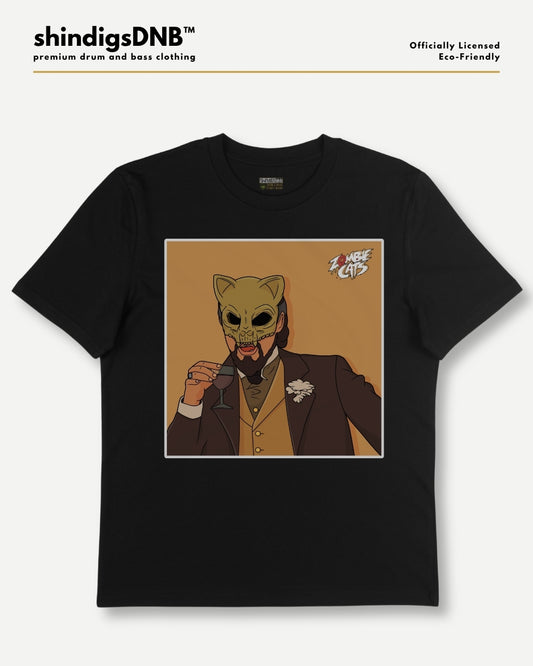 A black short-sleeve t-shirt with a central graphic print of a cartoon cat in a brown suit holding a glass, set against a light gray background. The brand name 'shindigsDNB' is visible at the top left.