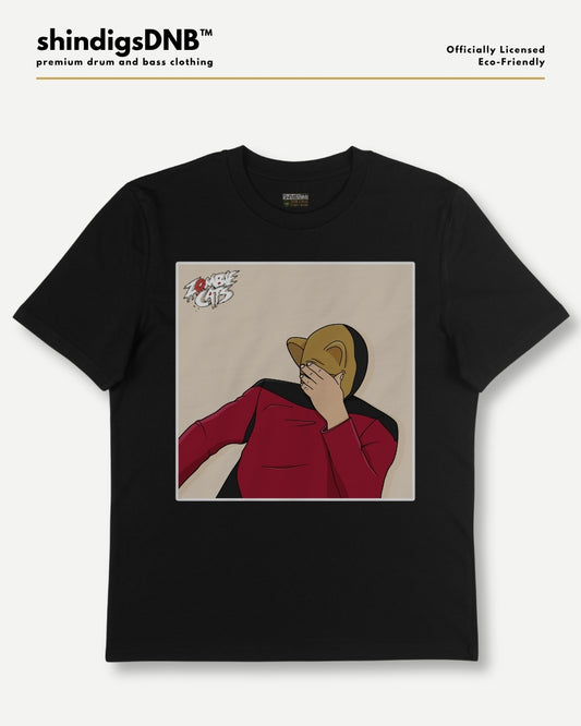 A black short-sleeve graphic t-shirt by shindigsDNB, featuring a square print of an illustrated figure in a red jacket and gold hat on a beige background. The t-shirt is displayed flat against a light gray background with the brand logo 'shindigsDNB' at the top.