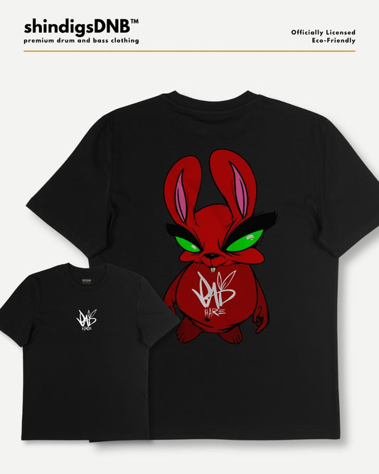 Black t-shirt apparel mockup showing a large red cartoon bunny graphic with green eyes on the back of a short-sleeve t-shirt, plus a smaller front-view inset of the same shirt with a small white chest logo. Text at top reads shindigsDNB and officially licensed eco-friendly.