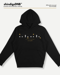 A black pullover hoodie with a graphic print on the chest featuring white and gold pixelated blocks and the text 'SIXTEEN'. The brand 'shindigsDNB' is displayed at the top left, and 'Officially Licensed' is at the top right, all on a light gray background.