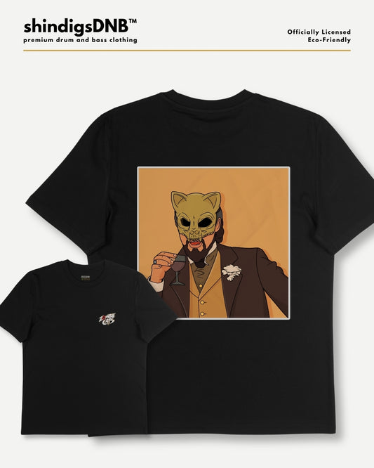 A black short-sleeve t-shirt shown in two sizes on a light gray background, with a large rectangular graphic print on the larger shirt. The print features an illustrated character wearing a cat mask and a brown suit against a warm tan background.
